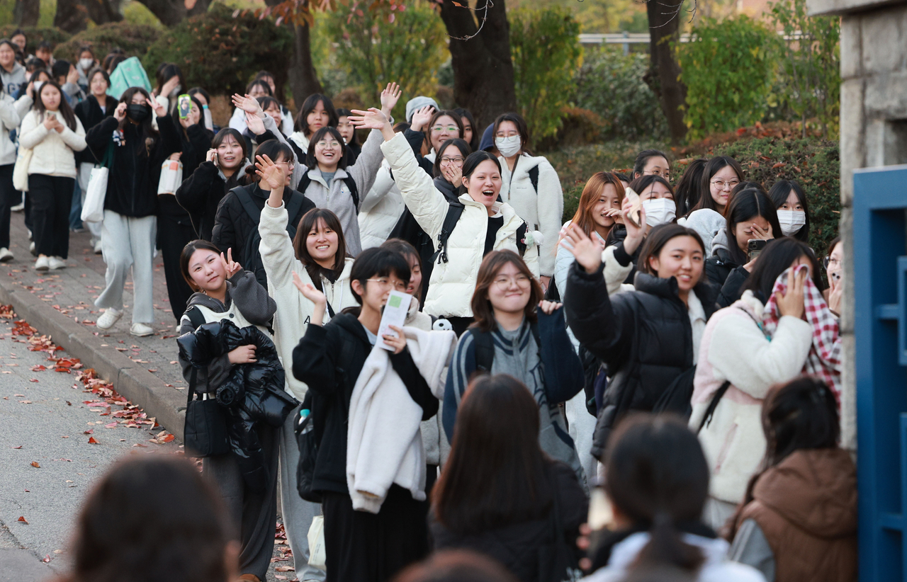 Students who finished the 2026 College Scholastic Ability Test at Yeongbok Girls’ High School in Suwon, Gyeonggi Province, leave the test site on Thursday. (Yonhap)
